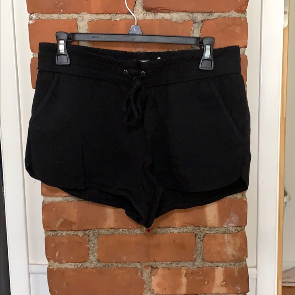 Black shorts with elastic waste and tie.